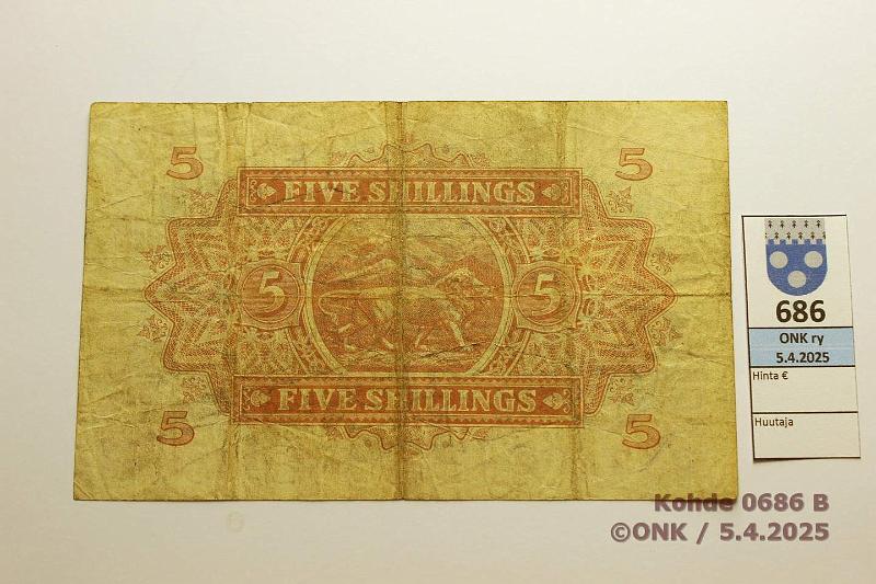 k-0686-b.jpg - Kohde 686 (kuva 2/2), lhthinta: 30 € / myyntihinta: 36 € East Africa (EACB) 5 shillings 1955 P#33 6mm rep, kunto: 4