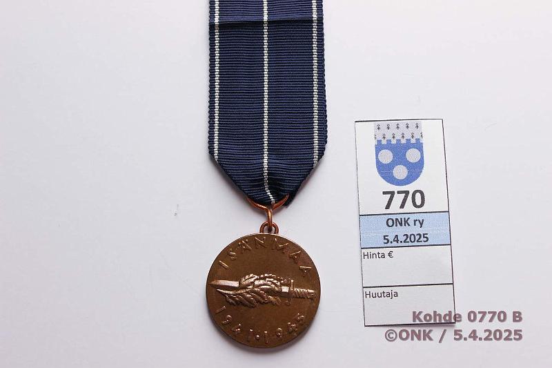 k-0770-b.jpg - Kohde 770 (kuva 2/2), lhthinta: 8 € / ei tarjouksia Jatkosodan muistomitali Myntkirja, kunto: 9